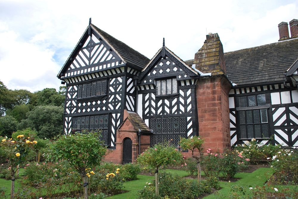 Black And White Timber Framed Medieval Mansion House And Gardens.