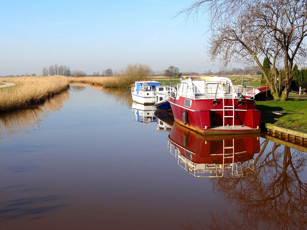 Free boat moored to dock in canal image, public domain CC0 photo.