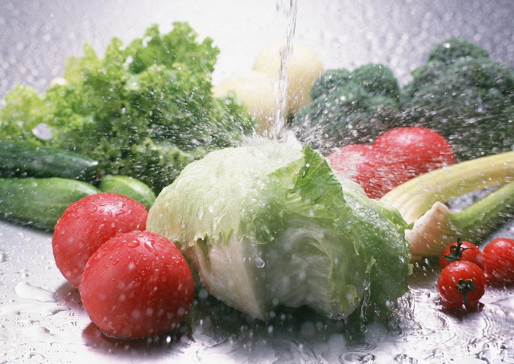 Fresh Tomato And Green Fresh Salad With Water Drop Splash