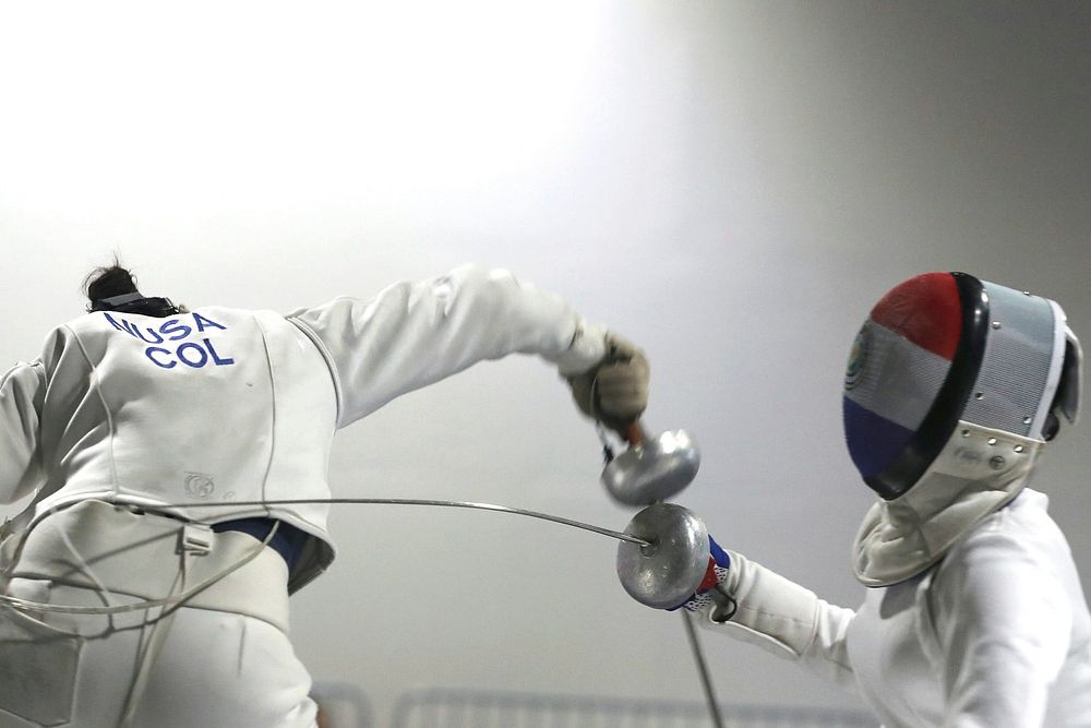Two Woman Fencing Athletes Fight On Professional Sports