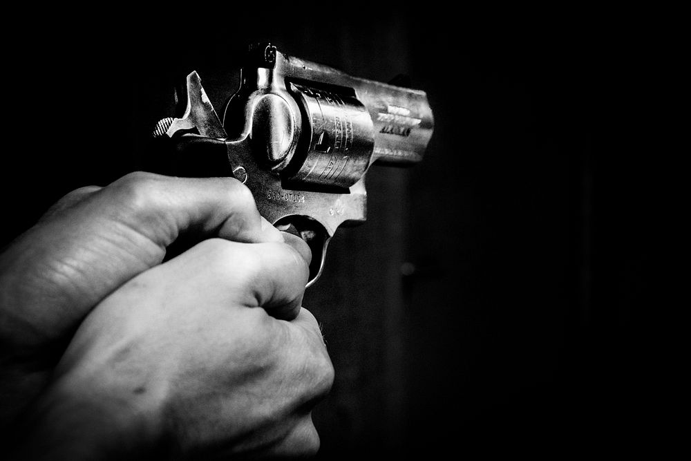 Free holding a gun image, public domain weapon CC0 photo.