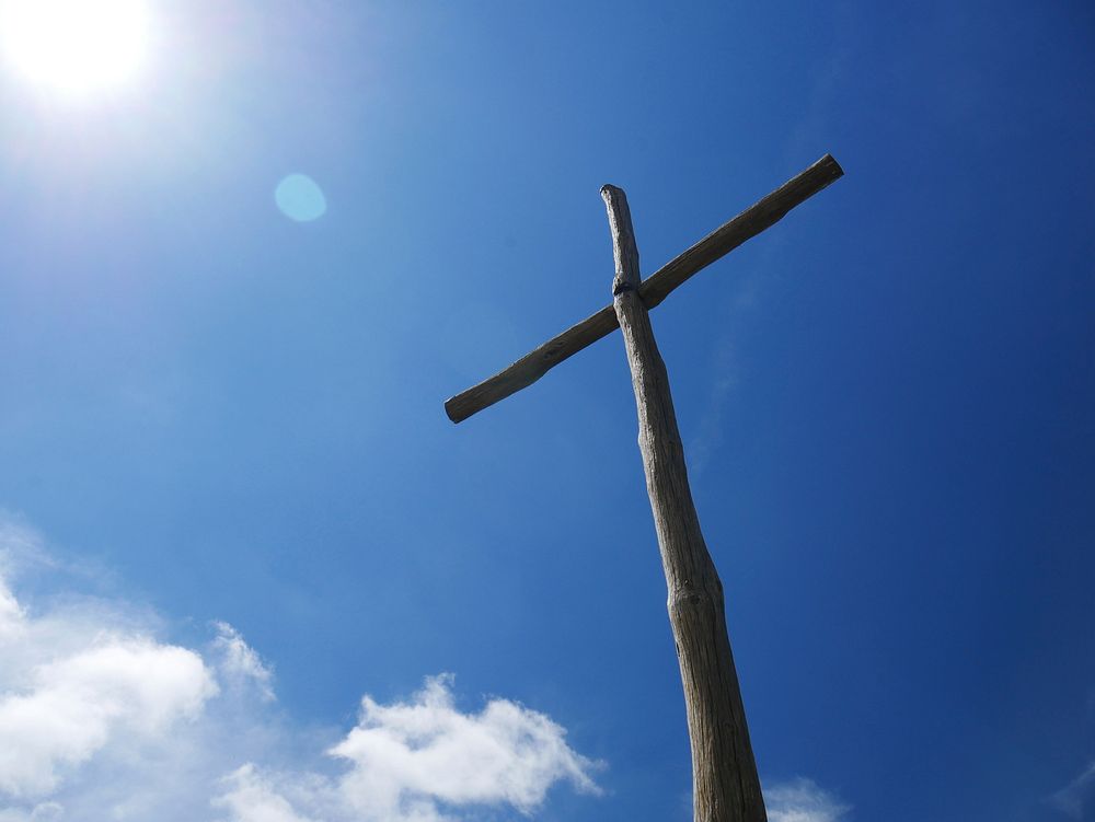 Free wooden cross, blue sky image, public domain crucifixion CC0 photo.
