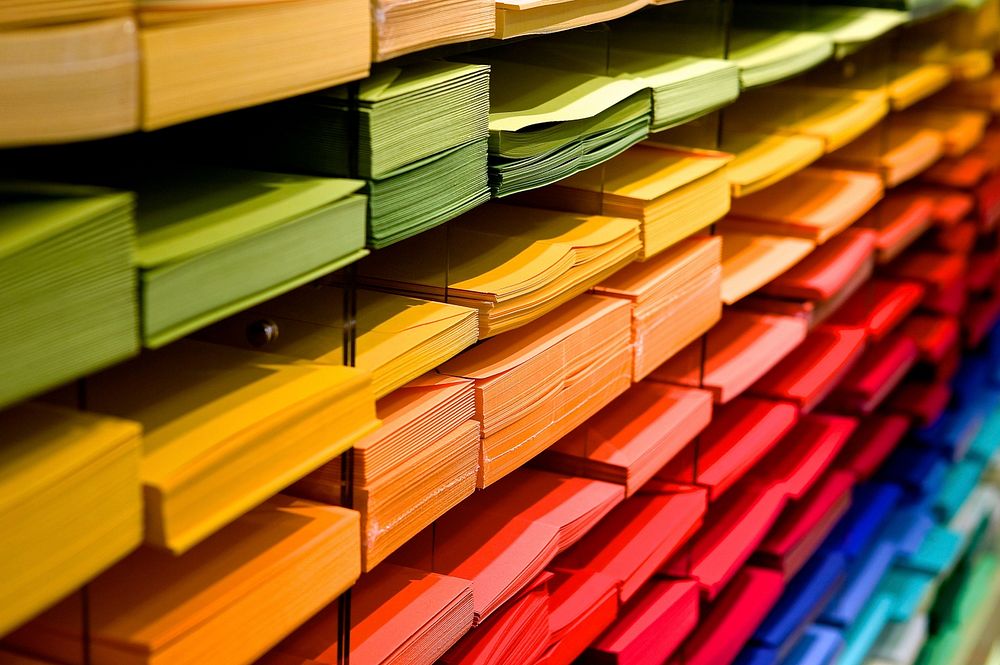 Free assorted colorful paper in holders image, public domain CC0 photo.