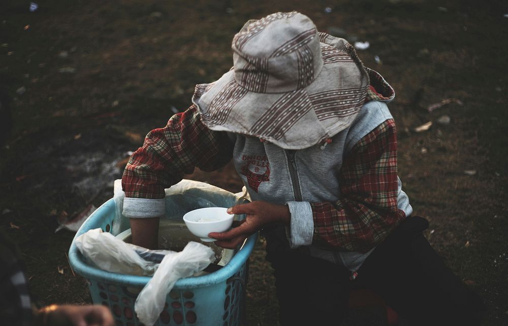 Free homeless eating rice image, public domain poverty CC0 photo.