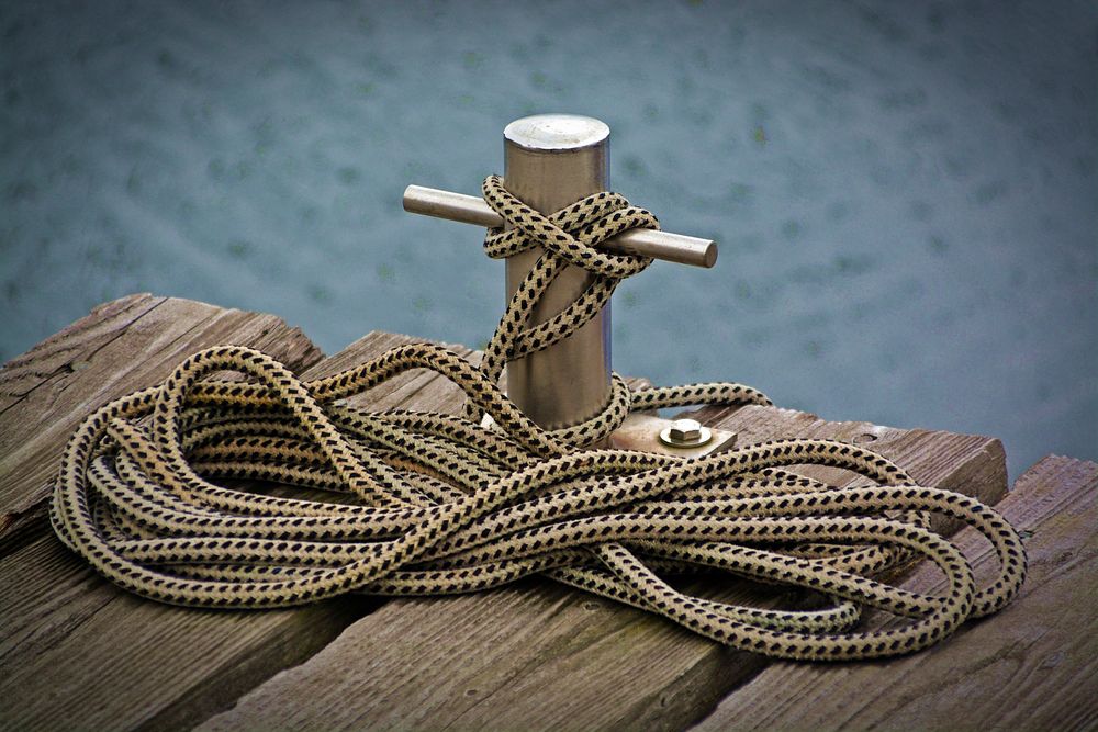 Free wood pier with anchor rope photo, public domain CC0 image.