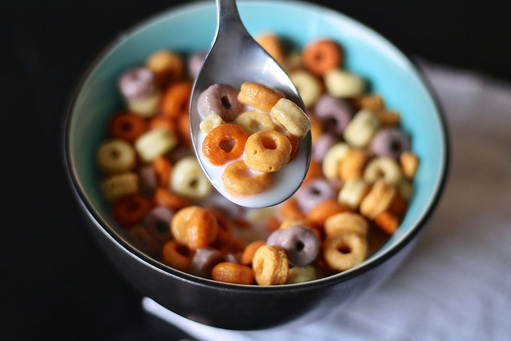 Free colorful Cherrios in spoon and milk image, public domain food CC0 photo