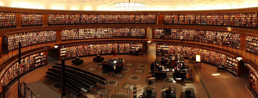 Free big open, multiple level library full of books photo, public domain CC0 image.