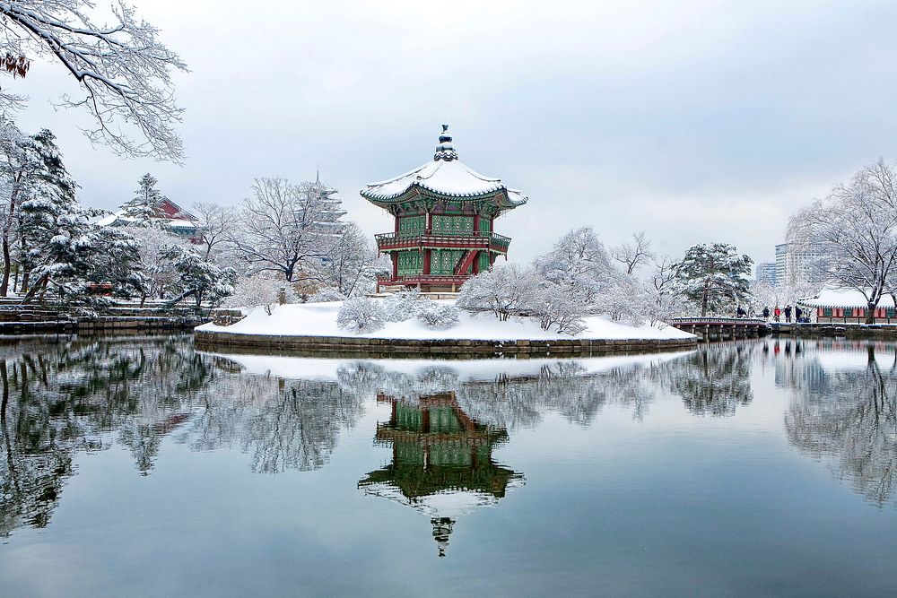 Chinese temple surrounded by snowy mountain and lake photo, free public domain CC0 image.