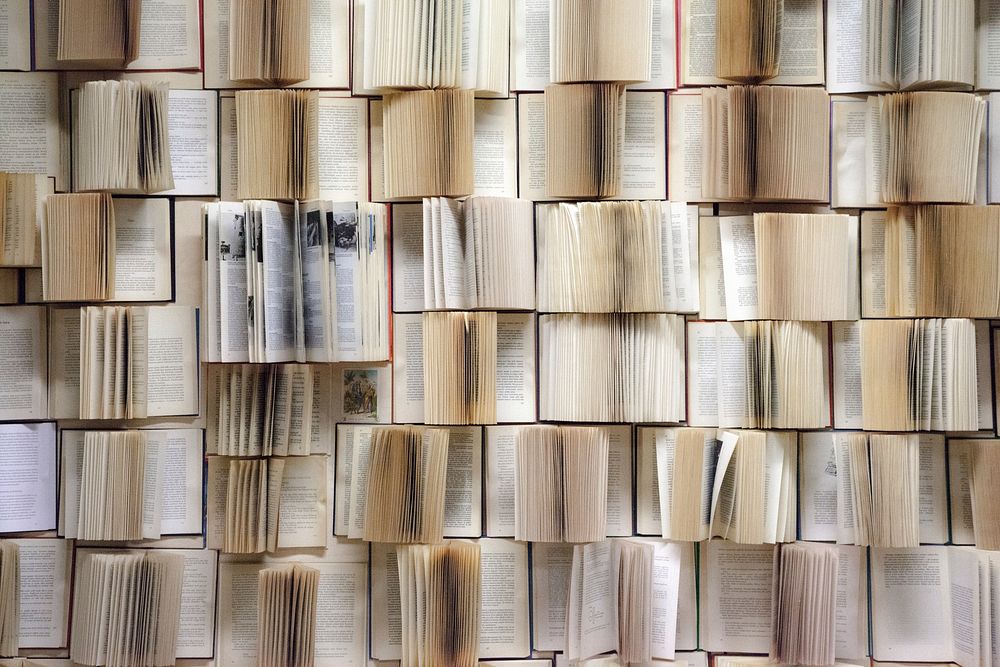 Free pile of open books photo, public domain CC0 image.