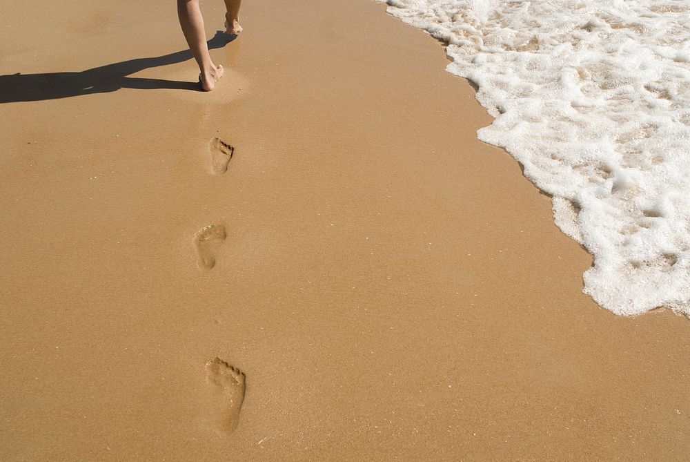 Free foot prints on sand image, public domain beach CC0 photo.