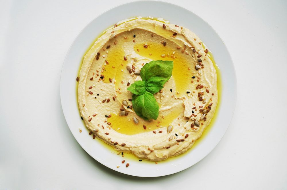 Free top down hummus on white plate image, public domain food CC0 photo.