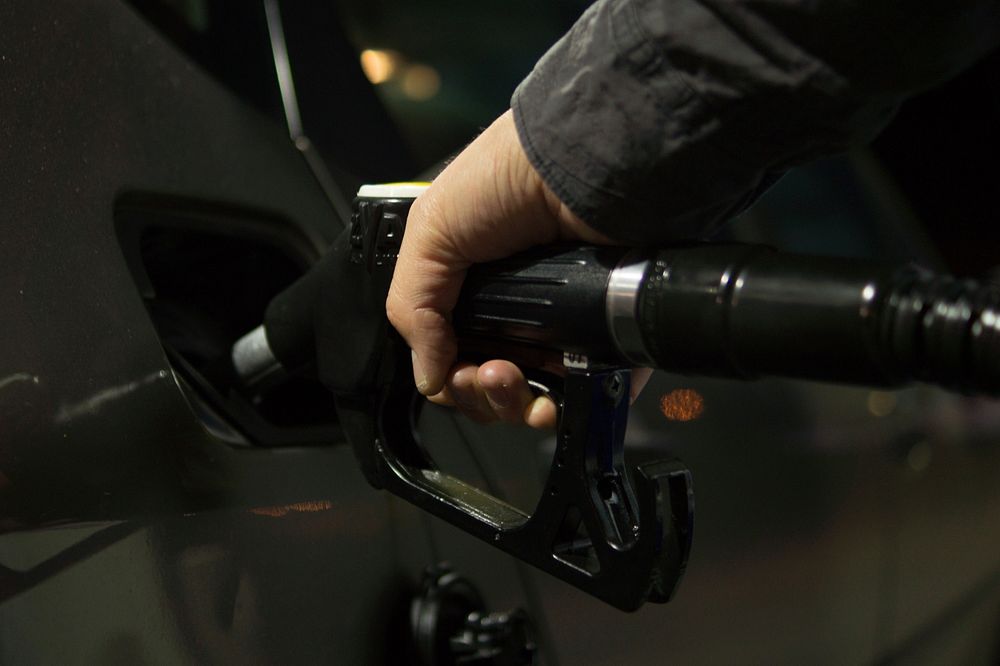 Gas pump filling fuel close up photo, free public domain CC0 image.