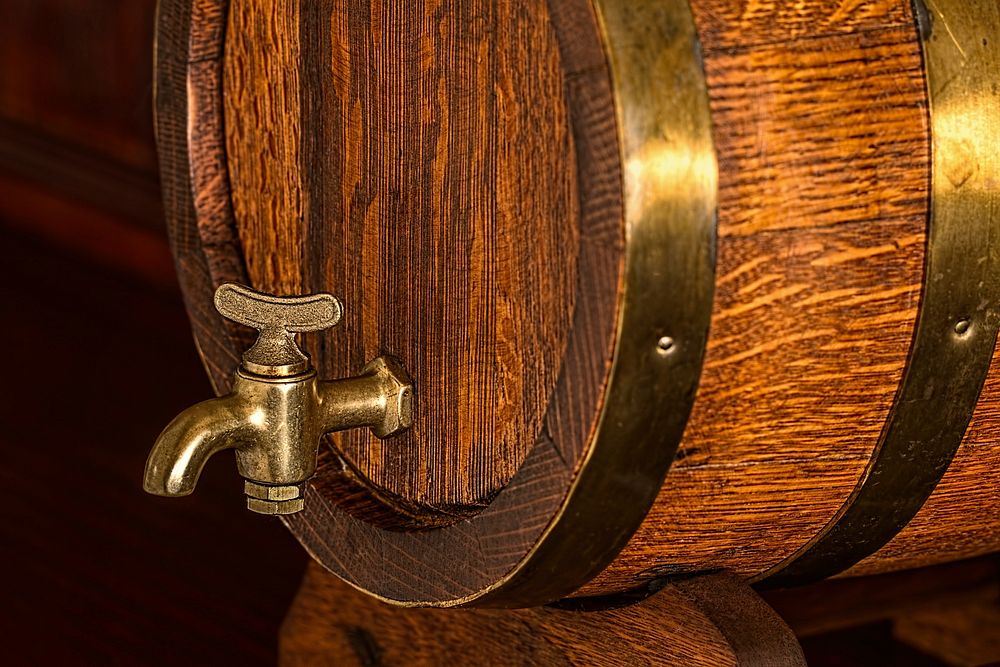 Free brass tap on oak wood beer barrel image, public domain CC0 photo.