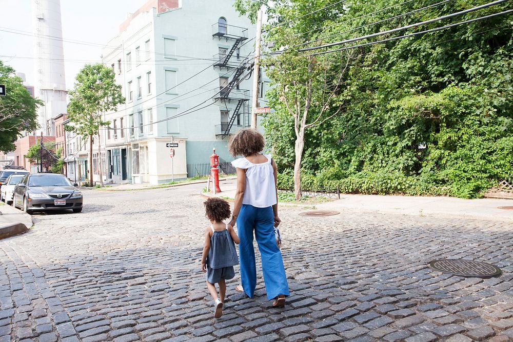 Free mom and daughter walking photo, public domain people CC0 image.