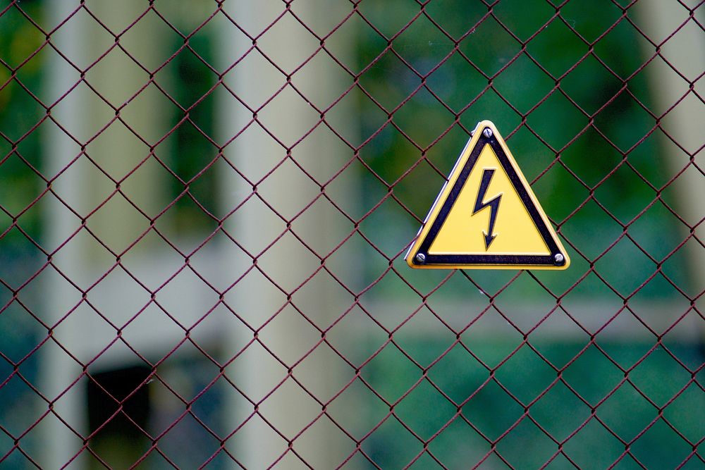 Free high voltage sign on wire fence image, public domain CC0 photo.