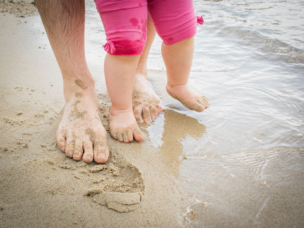 Free father and child walking on the beach image, public domain CC0 photo.