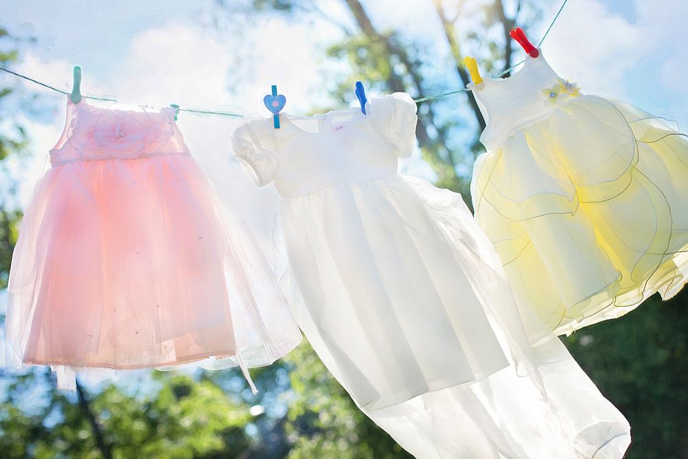 Free kids clothes hanging outside photo, public domain apparel CC0 image.