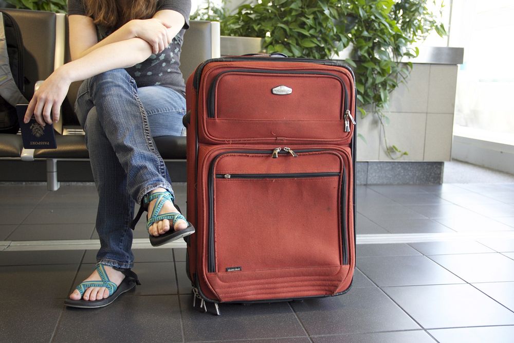 Traveler with luggage, free public domain CC0 image.