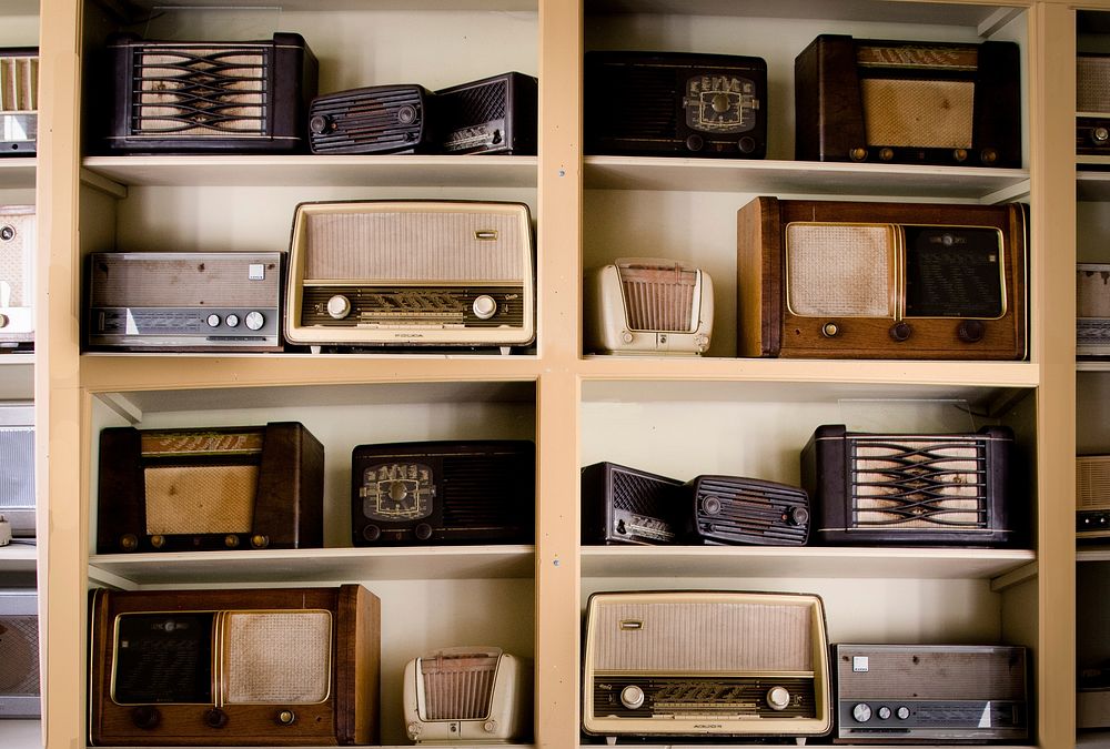 Vintage radios in thrift shop, free public domain CC0 image.