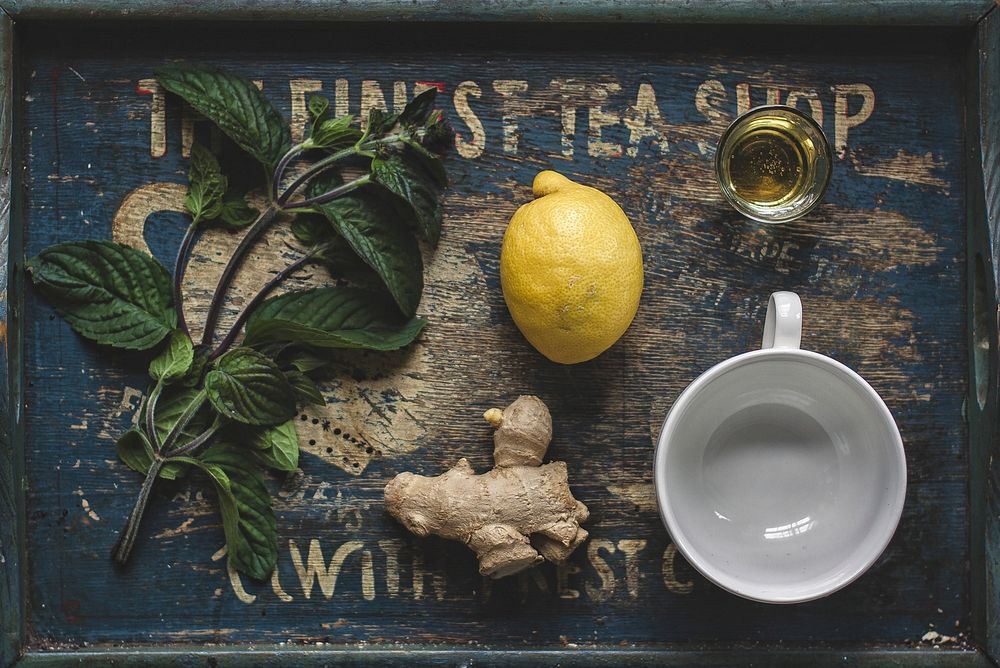 Free flat lay view of lemon, ginger, and a cup image, public domain cooking CC0 photo.