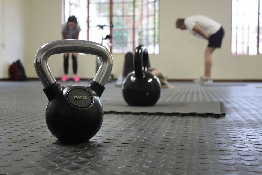 Free kettlebells on floor at gym image, public domain fitness CC0 photo.