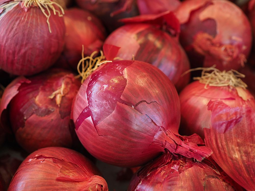 Free red onions background image, public domain vegetables CC0 photo.