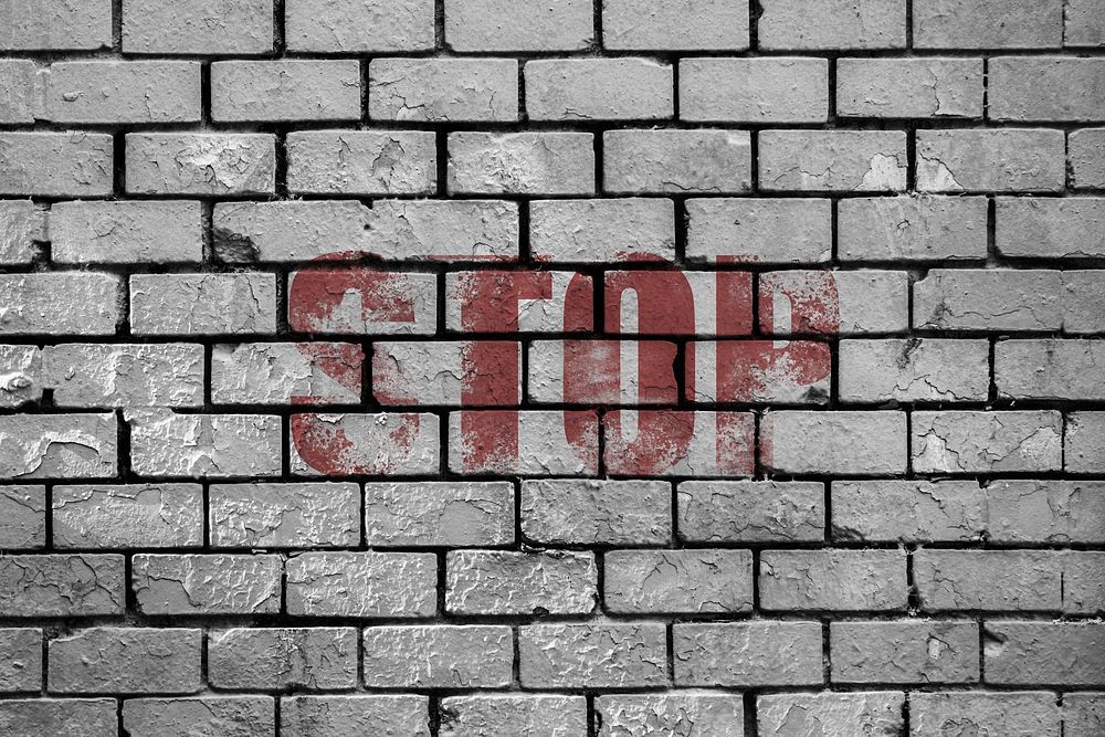 Free brick wall with stop text image, public domain CC0 photo.