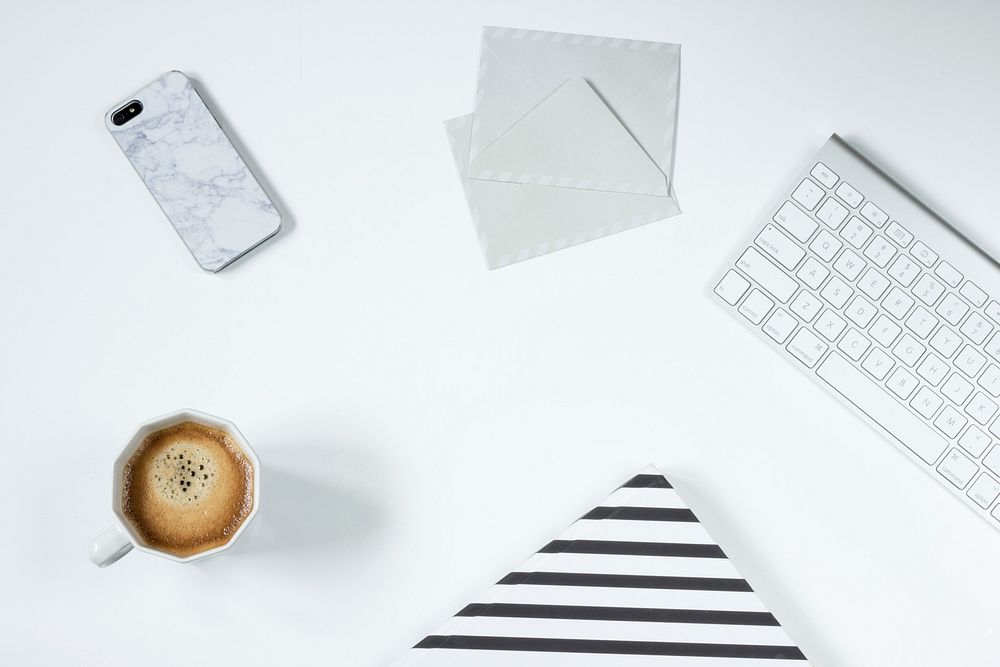 Free flat lay view of coffee cup at work photo, public domain work CC0 image.