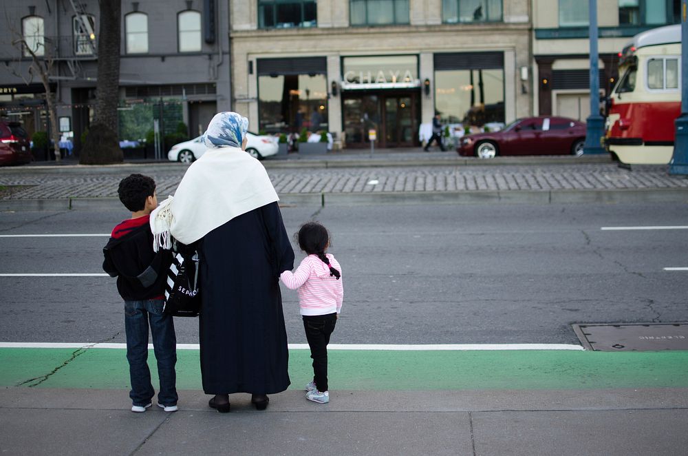 Muslim mother and children crossing the street, unknown location - 02/23 2017