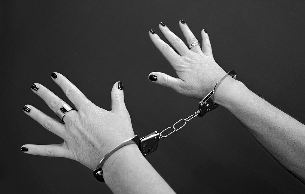 Free handcuffed hands image, public domain CC0 photo.