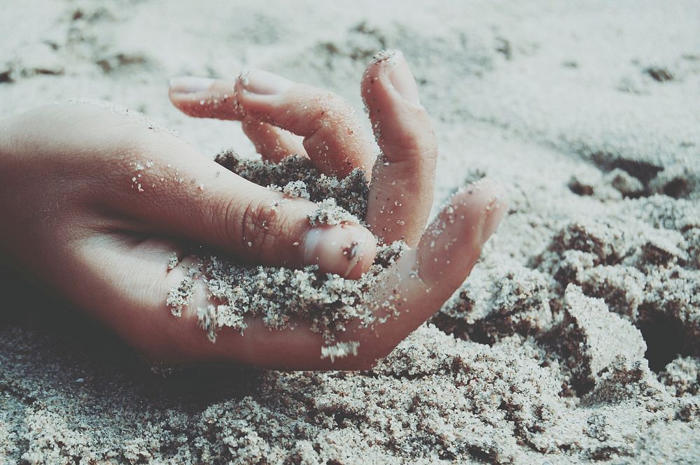 Free hand in the sand image, public domain beach CC0 photo.