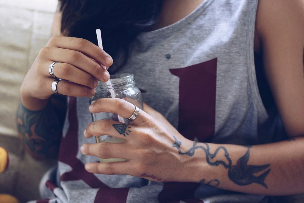 Girl drinking from a mason jar. Free public domain CC0 photo.