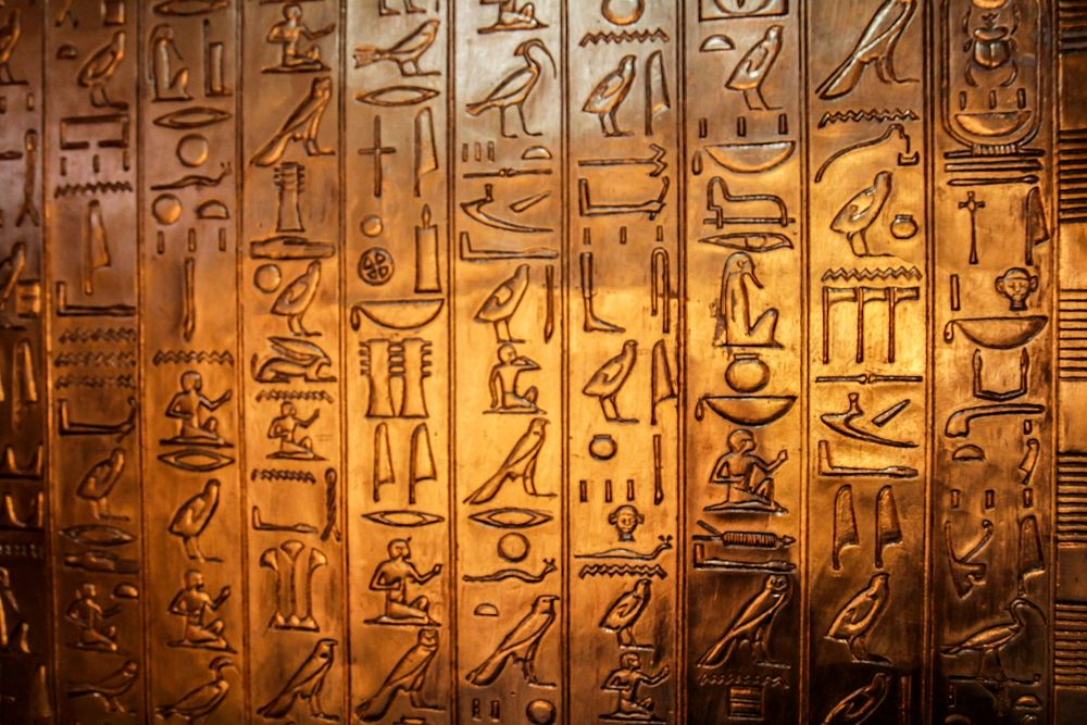 Hieroglyphics on gold metal, free public domain CC0 photo