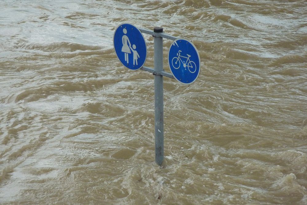 Free flooding road sign in water image, public domain CC0 photo.