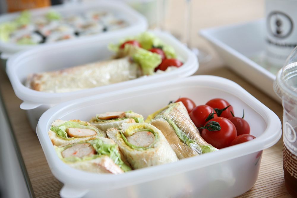 Free sandwich roll with tomato in lunch box image, public domain CC0 photo.