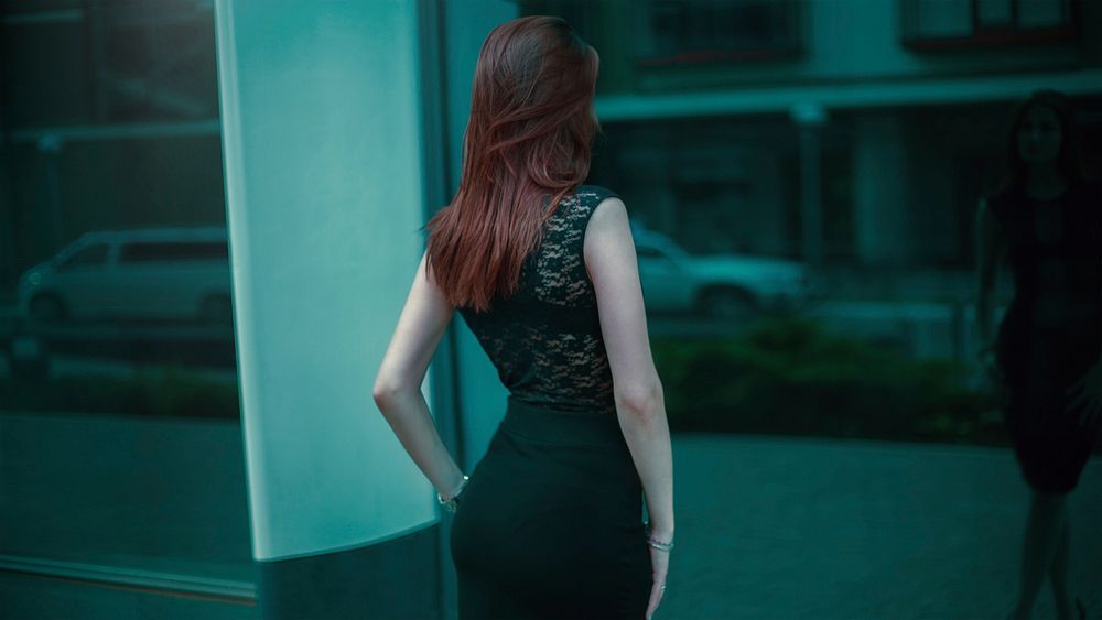 Free red-haired woman in black dress image, public domain human CC0 photo.
