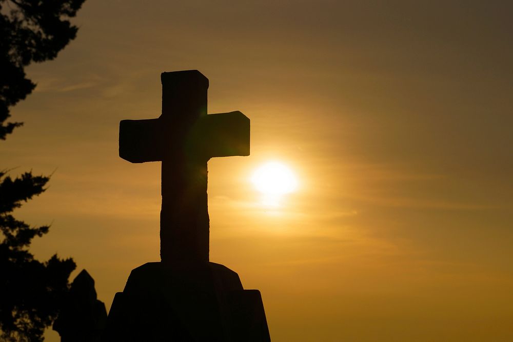 Free silhouette of a cross during sunrise image, public domain religion CC0 photo.