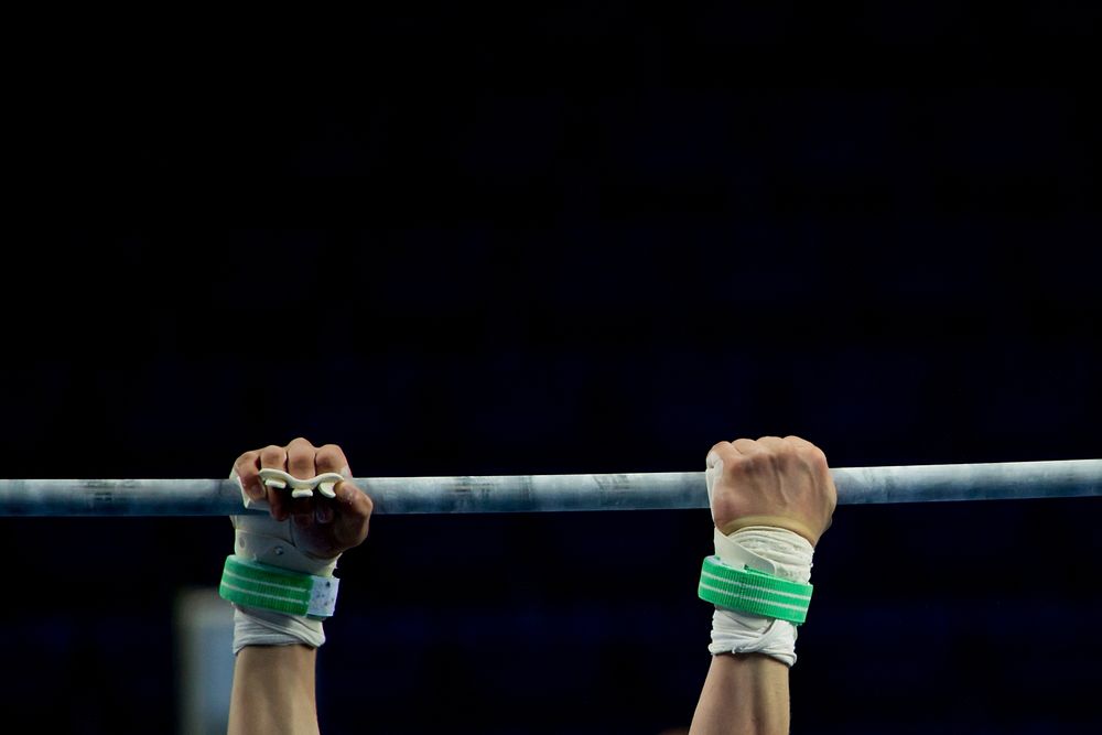 Gymnast's hands gripping bar, free public domain CC0 photo