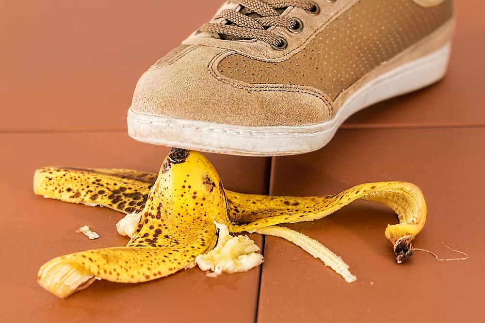 Free person stepping on banana peel public domain CC0 photo.