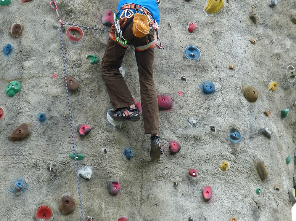 Free person climbing indoor rock wall photo, public domain sport CC0 image.