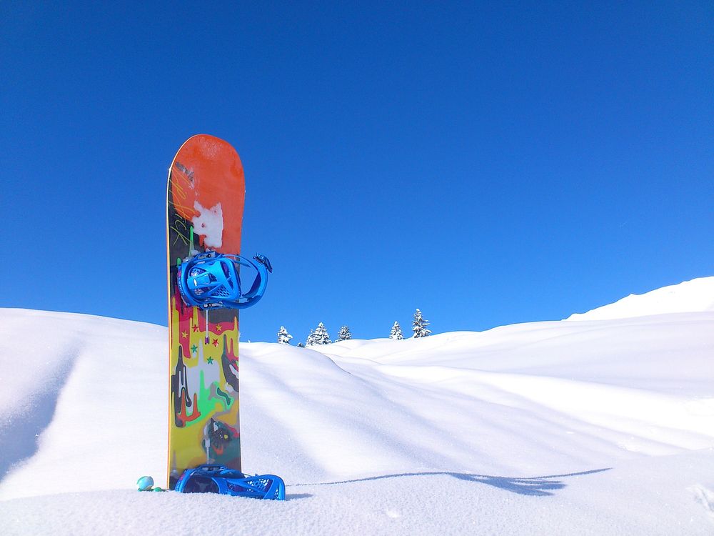 Free snowboard in snow image, public domain sport CC0 photo.