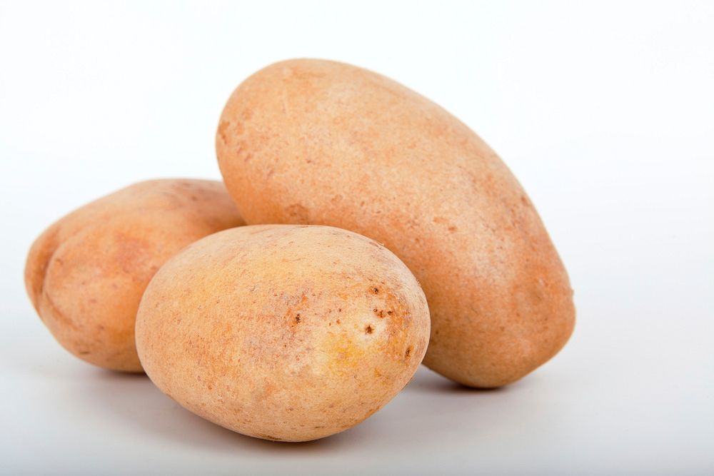 Free close up potato on table image, public domain vegetable CC0 photo.