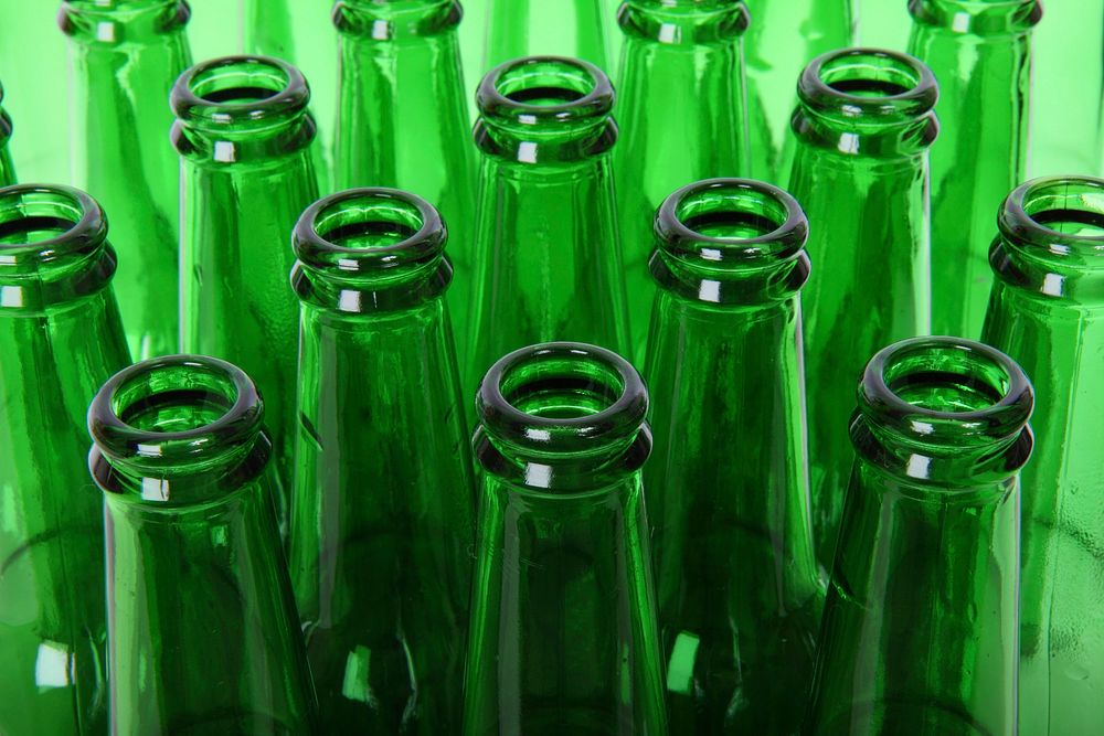 Free green glass bottle close up background public domain CC0 photo.