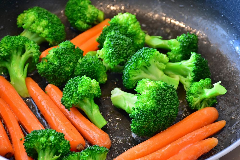 Free broccoli and carrot in frying pan photo, public domain vegetables CC0 image.