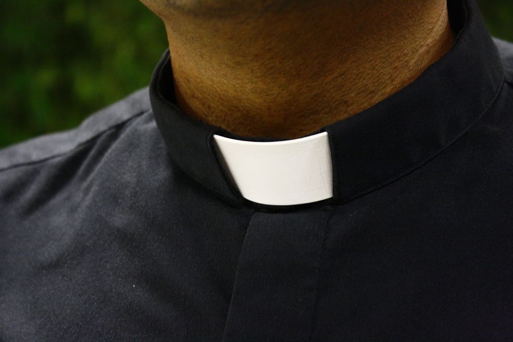 Priest with clerical collar, free public domain CC0 image.