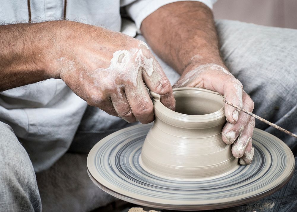 Free person making handmade pottery photo, public domain ceramics CC0 image.