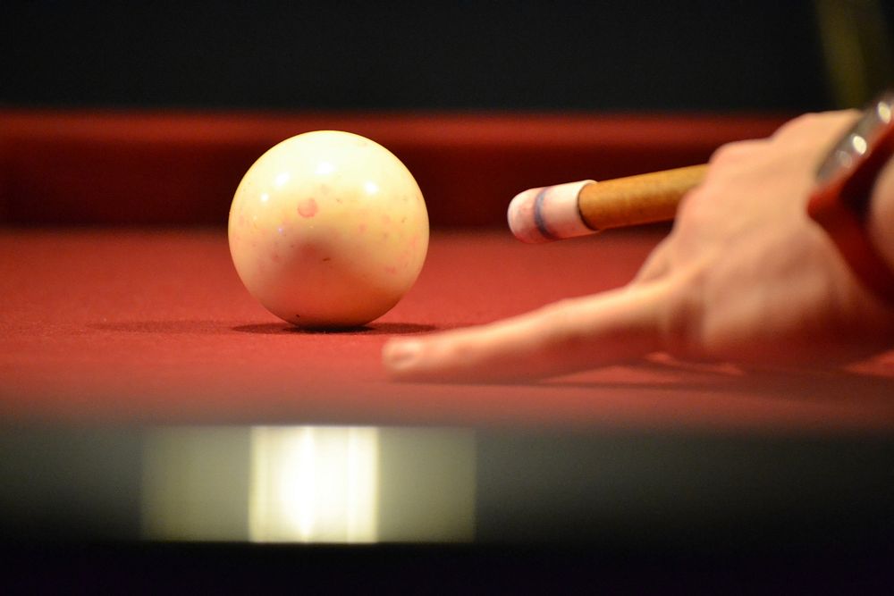 Free white pool ball with hand image, public domain CC0 photo.
