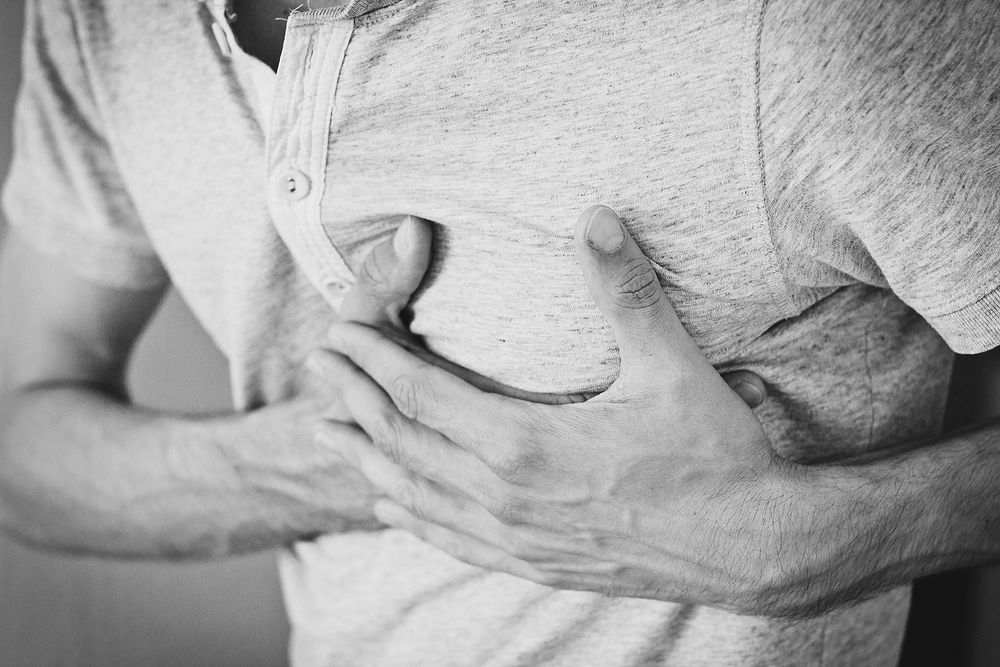 Holding chest in pain, free public domain CC0 photo