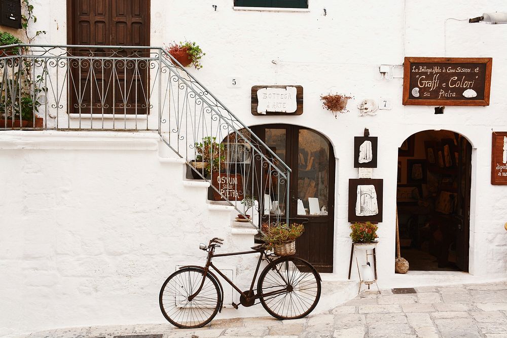 Free bike leaning against white wall image, public domain vehicle CC0 photo.