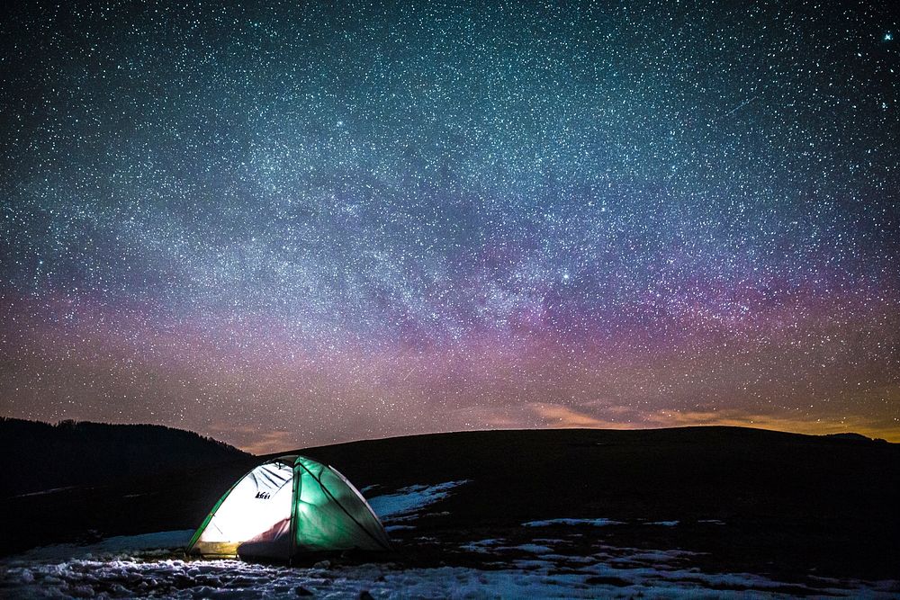 Camping under galaxy starry night sky, free public domain CC0 photo.